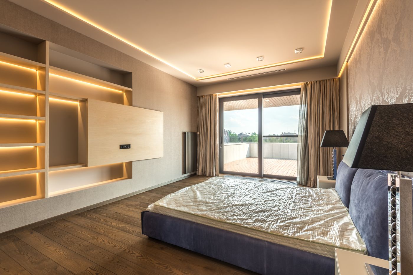 A modern bedroom opening onto a private terrace